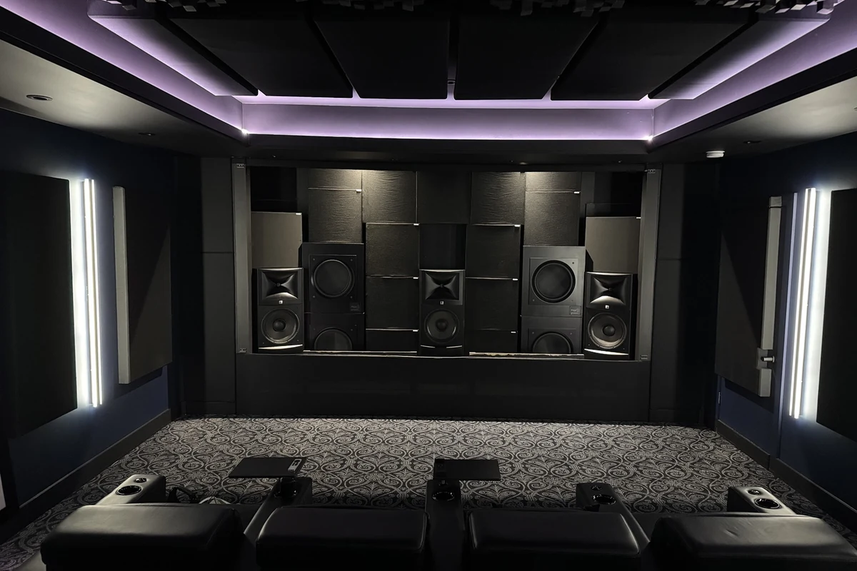 Private theater facing a front speaker and subwoofer system